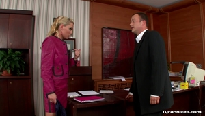 Bends over in office in HD