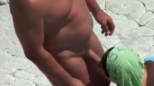 Bends over at the beach in HD